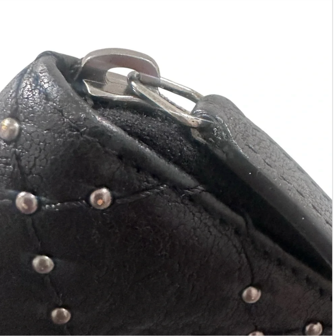 CHANEL Black Quilted Studded Medium Zippy Wallet